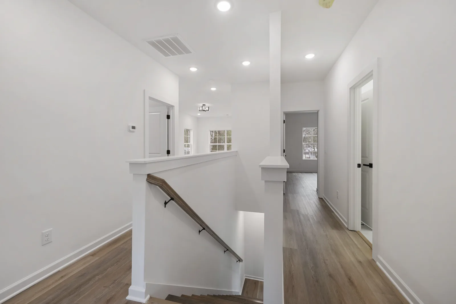 Upstairs hall and stair rail, bedrooms off either side