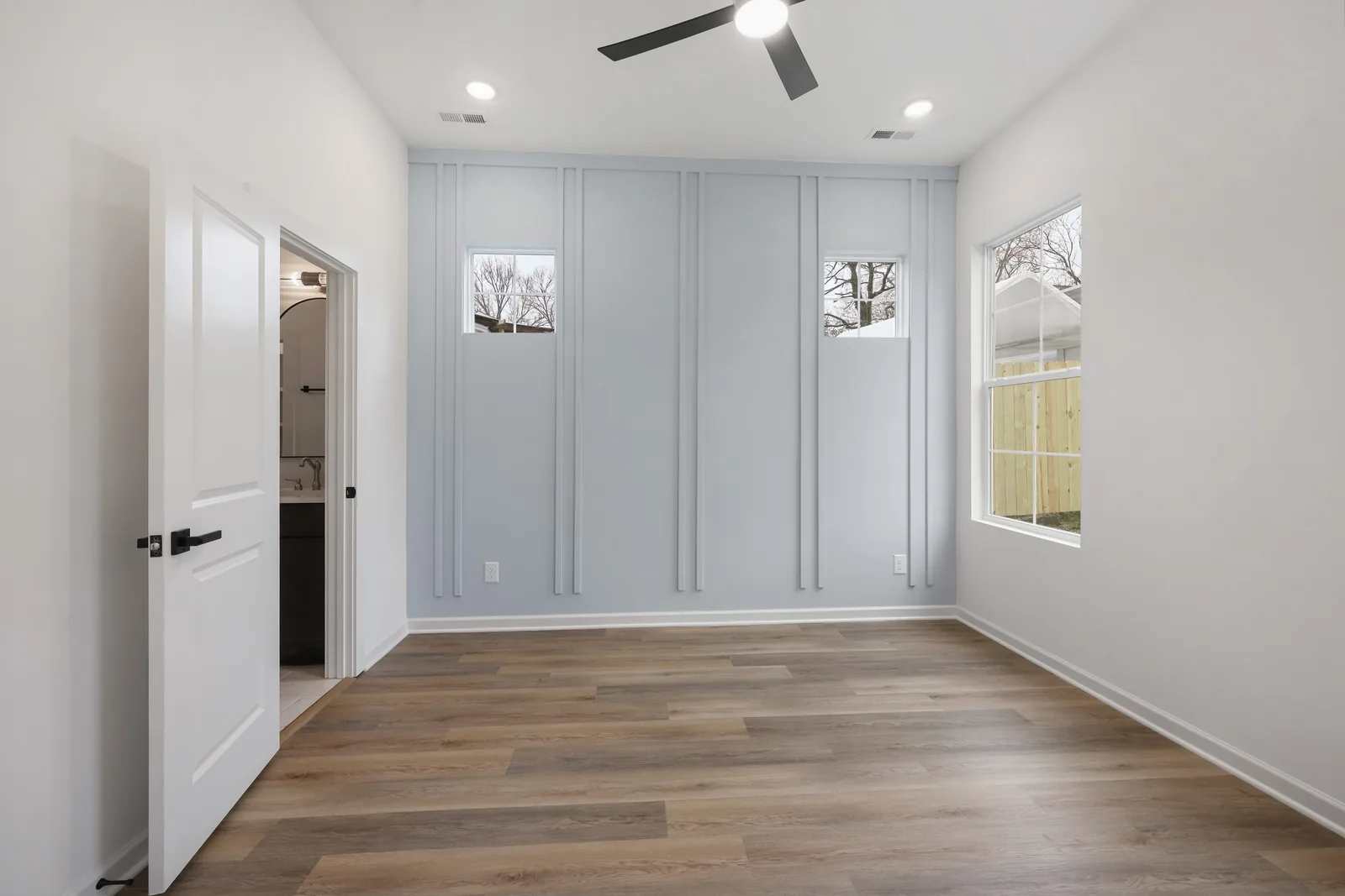 Bedroom accent wall in pale blue board-and-batten