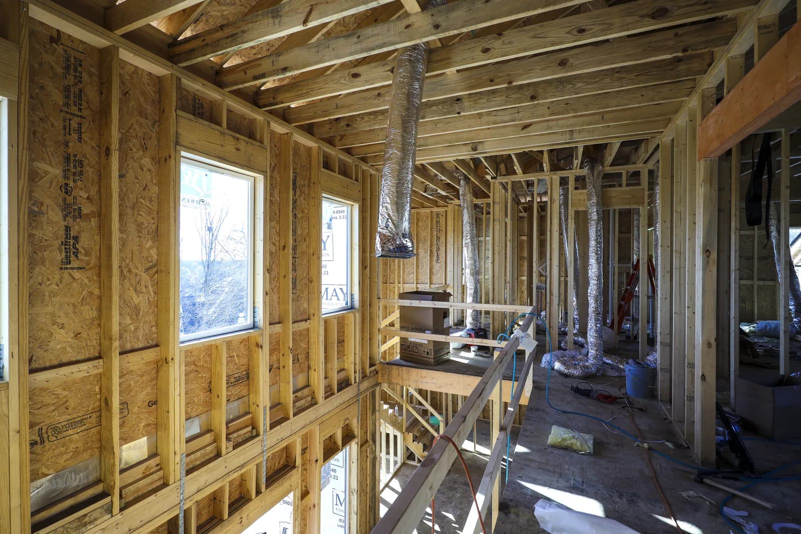 Two-story framed interior during construction