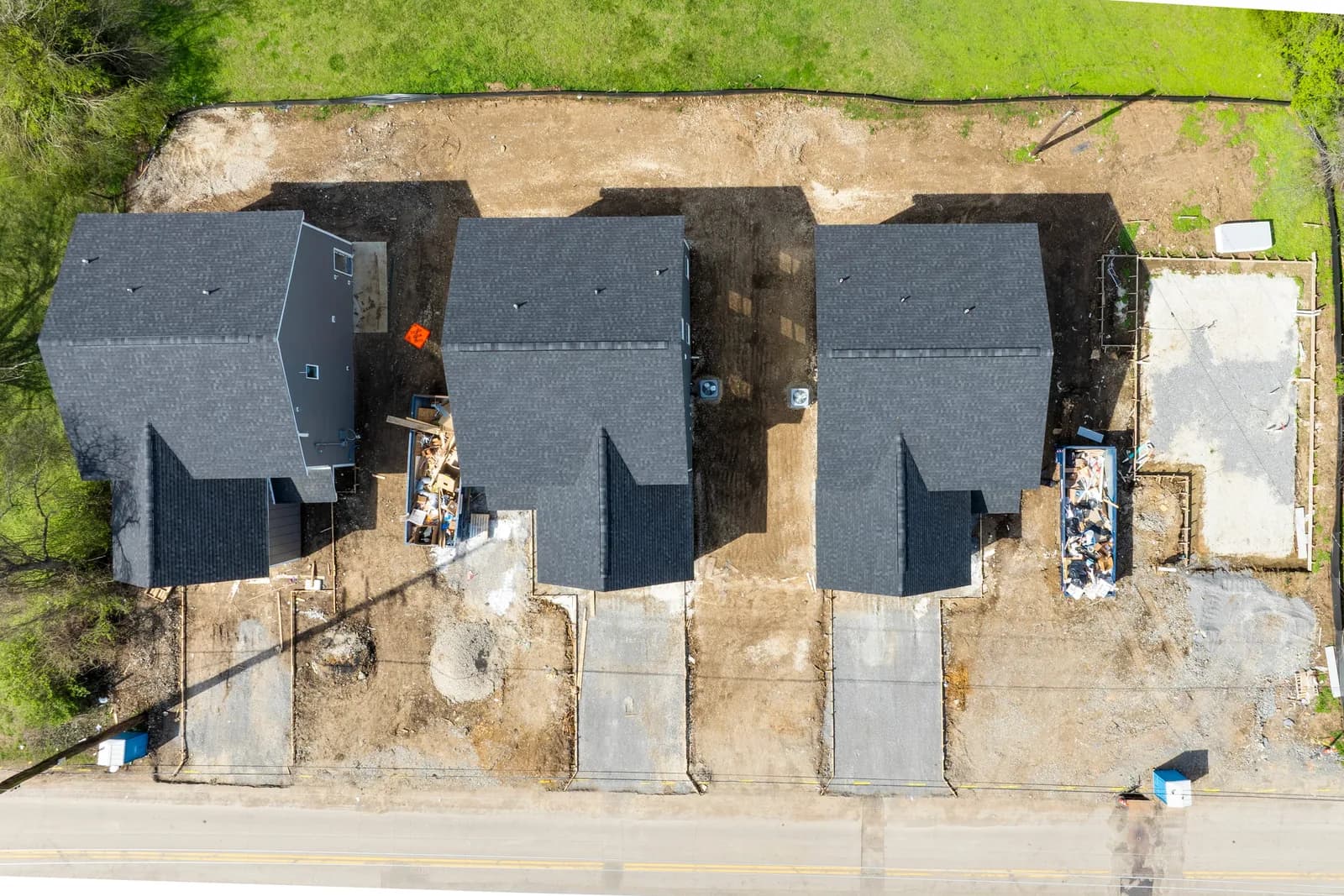 Overhead aerial of the three Forest Park roofs and freshly poured drives
